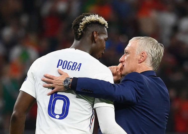 France's midfielder Paul Pogba speaks to France's coach Didier Deschamps after the UEFA EURO 2020 Group F football match between Portugal and France at Puskas Arena in Budapest on June 23, 2021. (Photo by FRANCK FIFE / POOL / AFP)